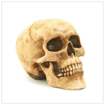 GRINNING SKULL FIGURINE